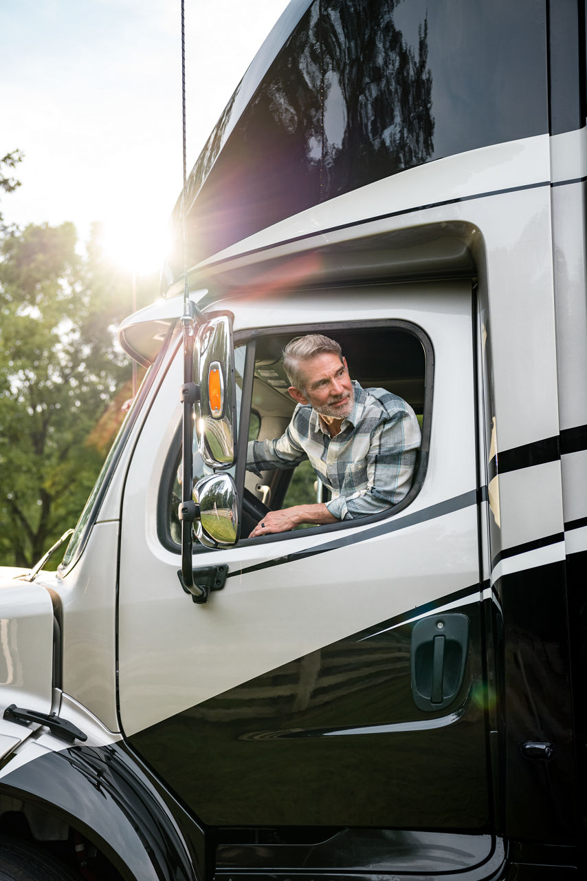 image of man looking out of coach window