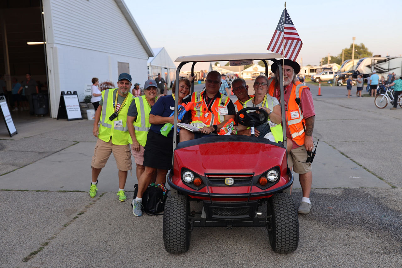 Winnebago workers in cart