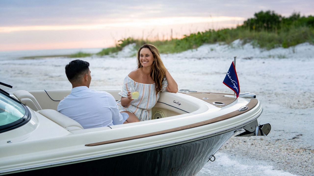 Two people in a. boat on the shore