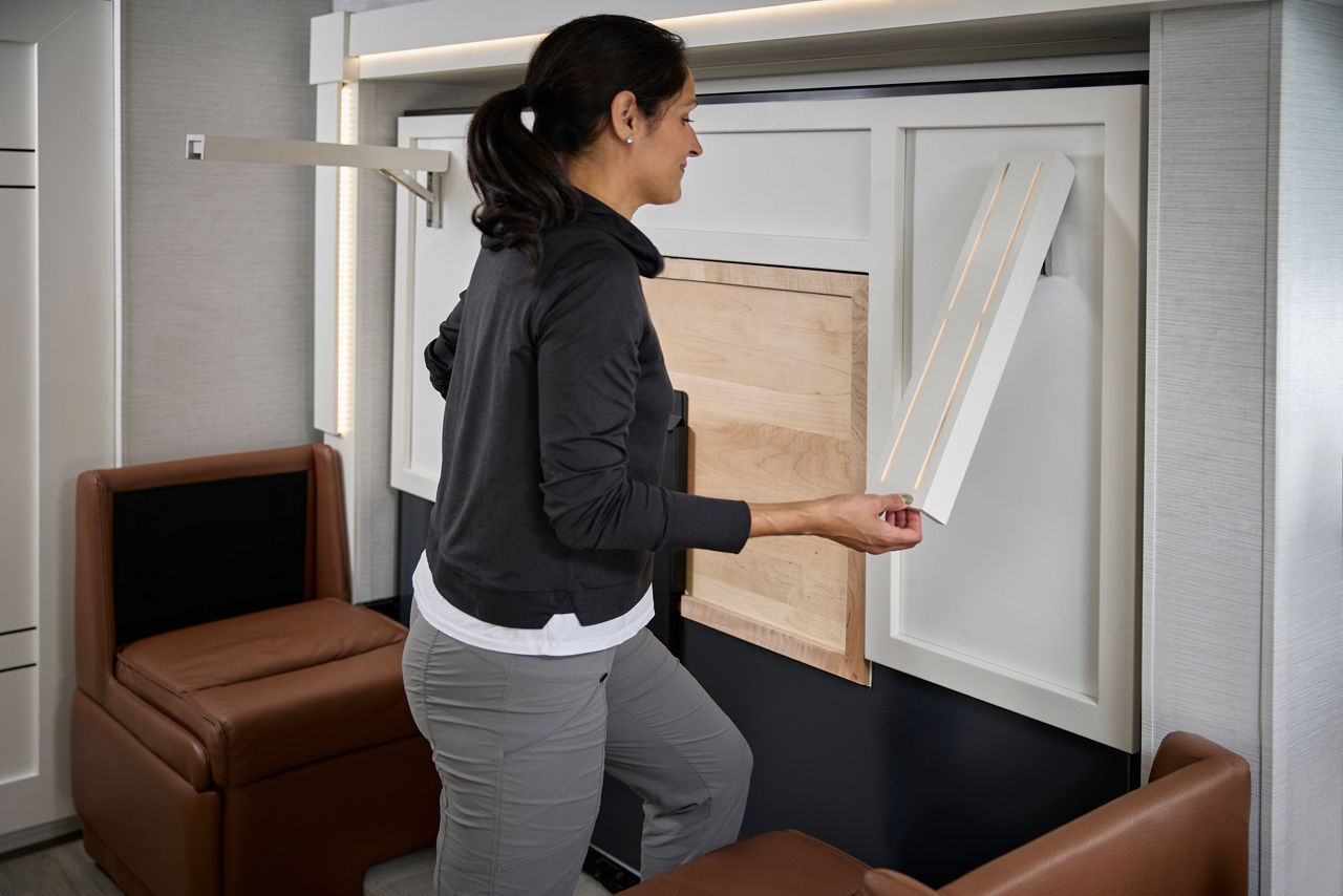 Woman Opening Bed in Freedom Aire