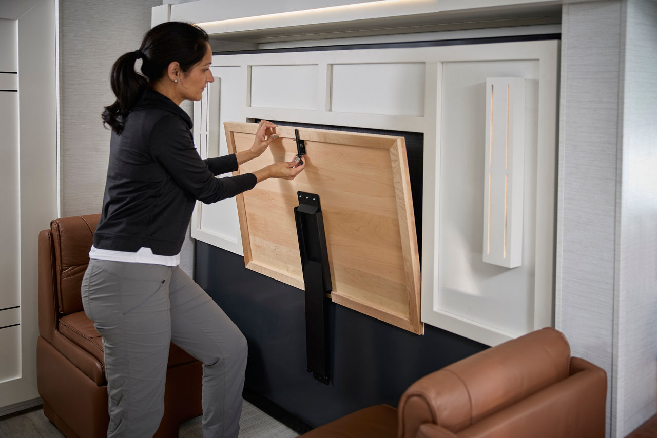Woman closing dinette in Freedom Aire