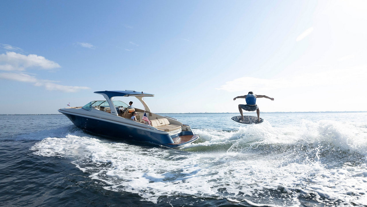 Launch 35 GT With A Surfer Behind It