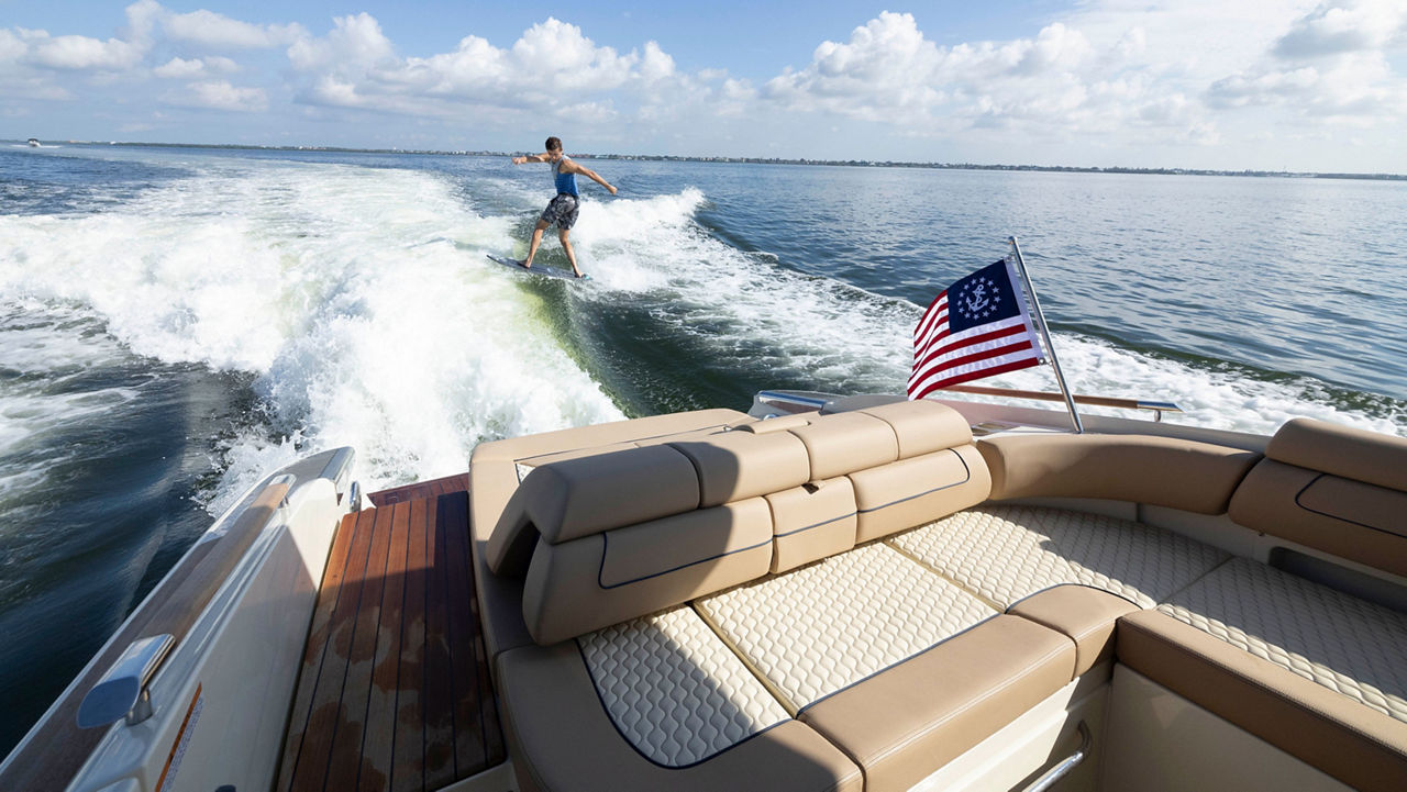 Surfer Behind The Launch 35 GT 