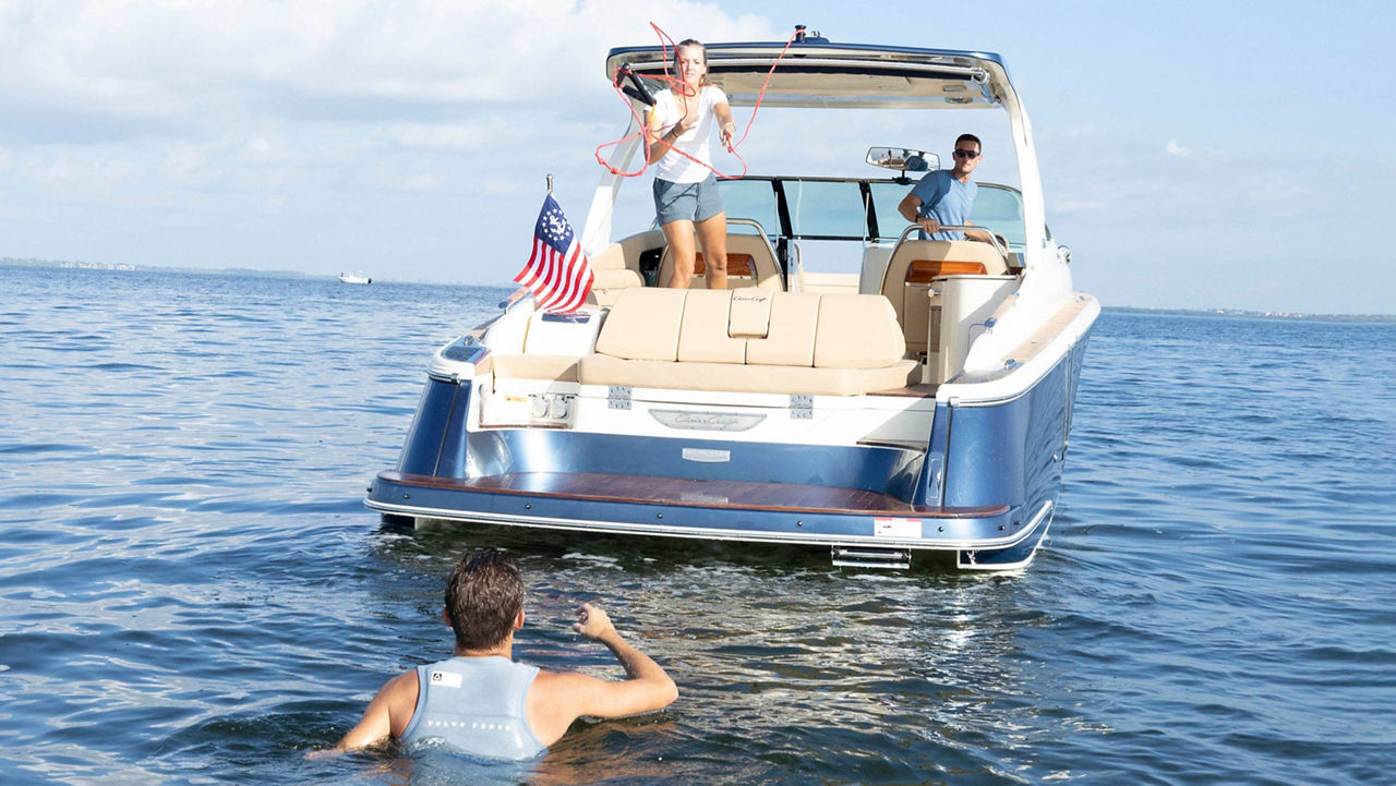 Surfer waiting behind the Launch 35 GT