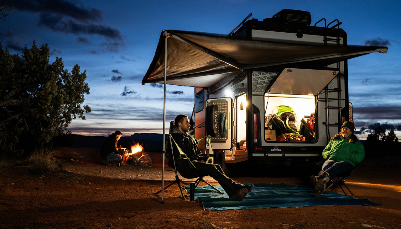 Man with a bike with winnebago trailer