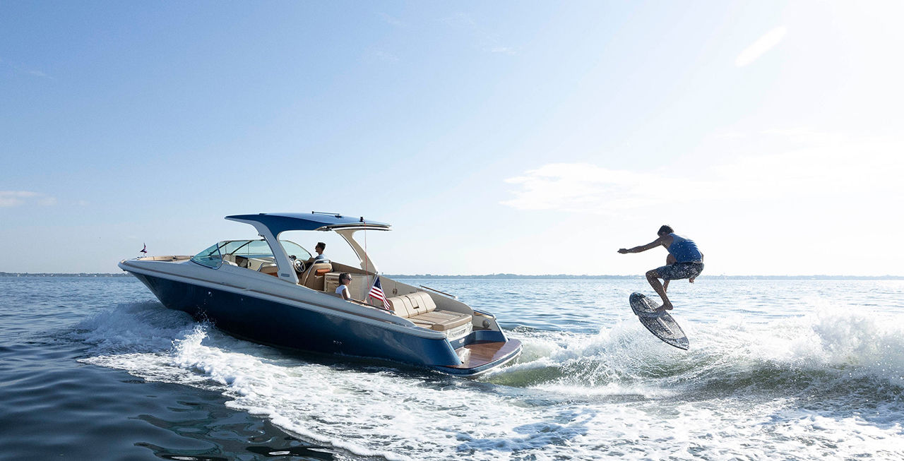 Surfer behind a Launch 35 GT Surf