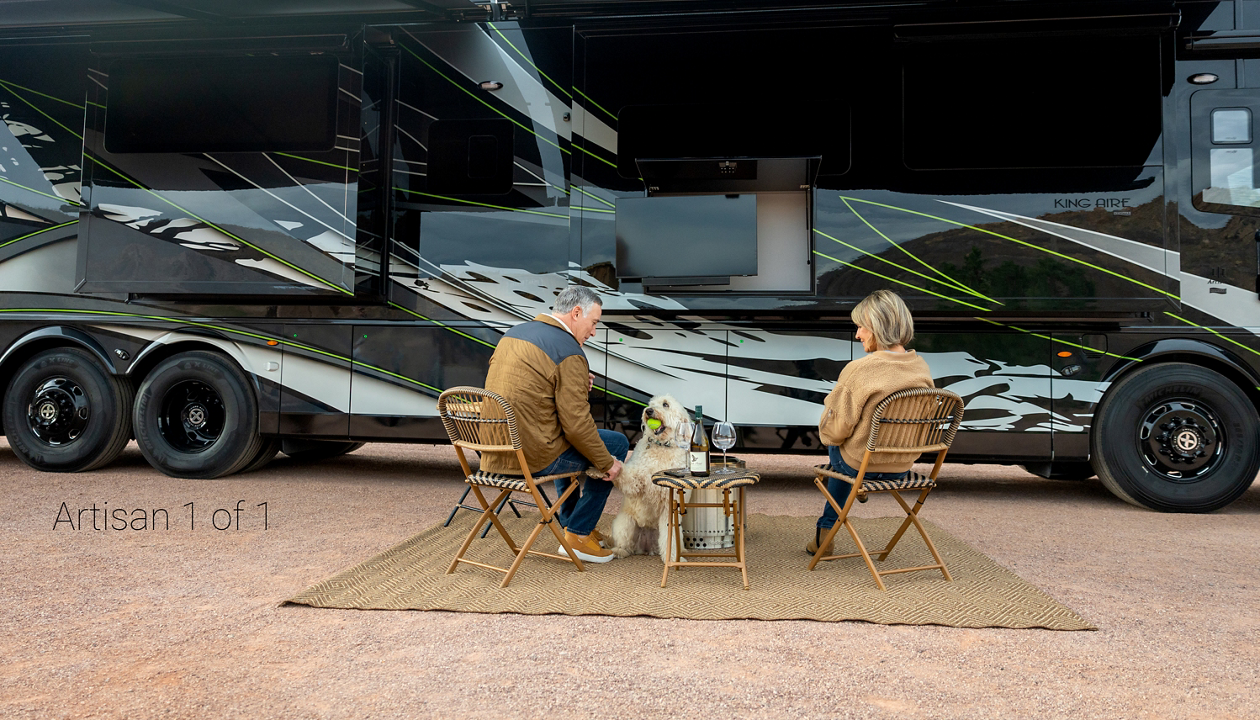 couple sitting out side of coach