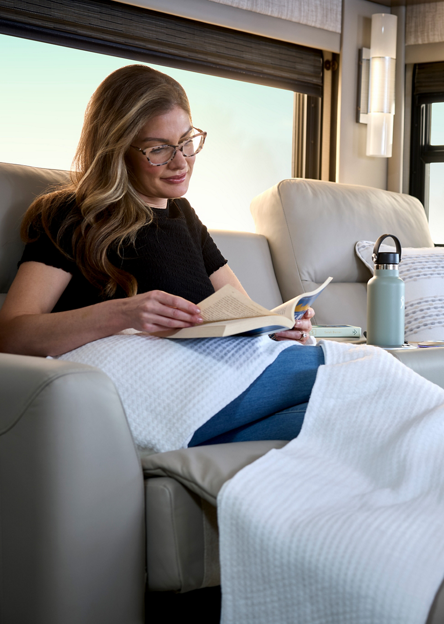 woman reading on sofa