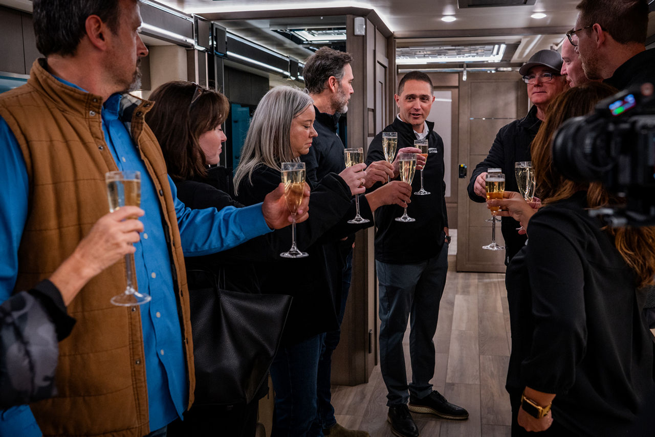 Workers toasting to the legacy of Newmar