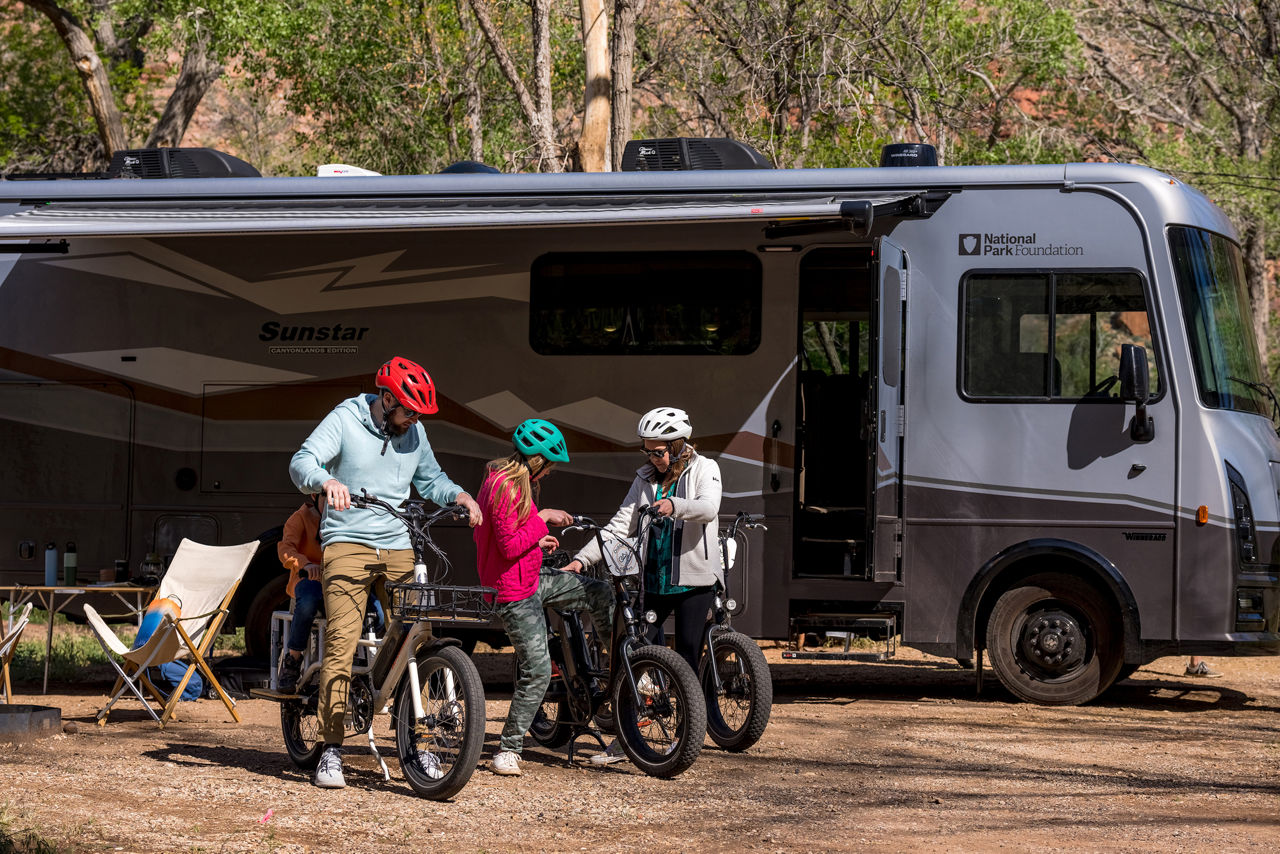 image of winnebago coach and mountain bikers