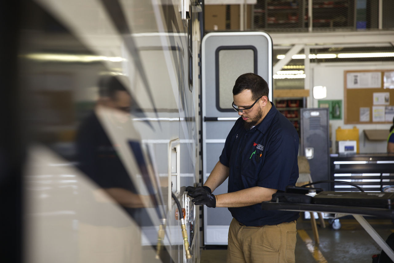 person working on vehicle