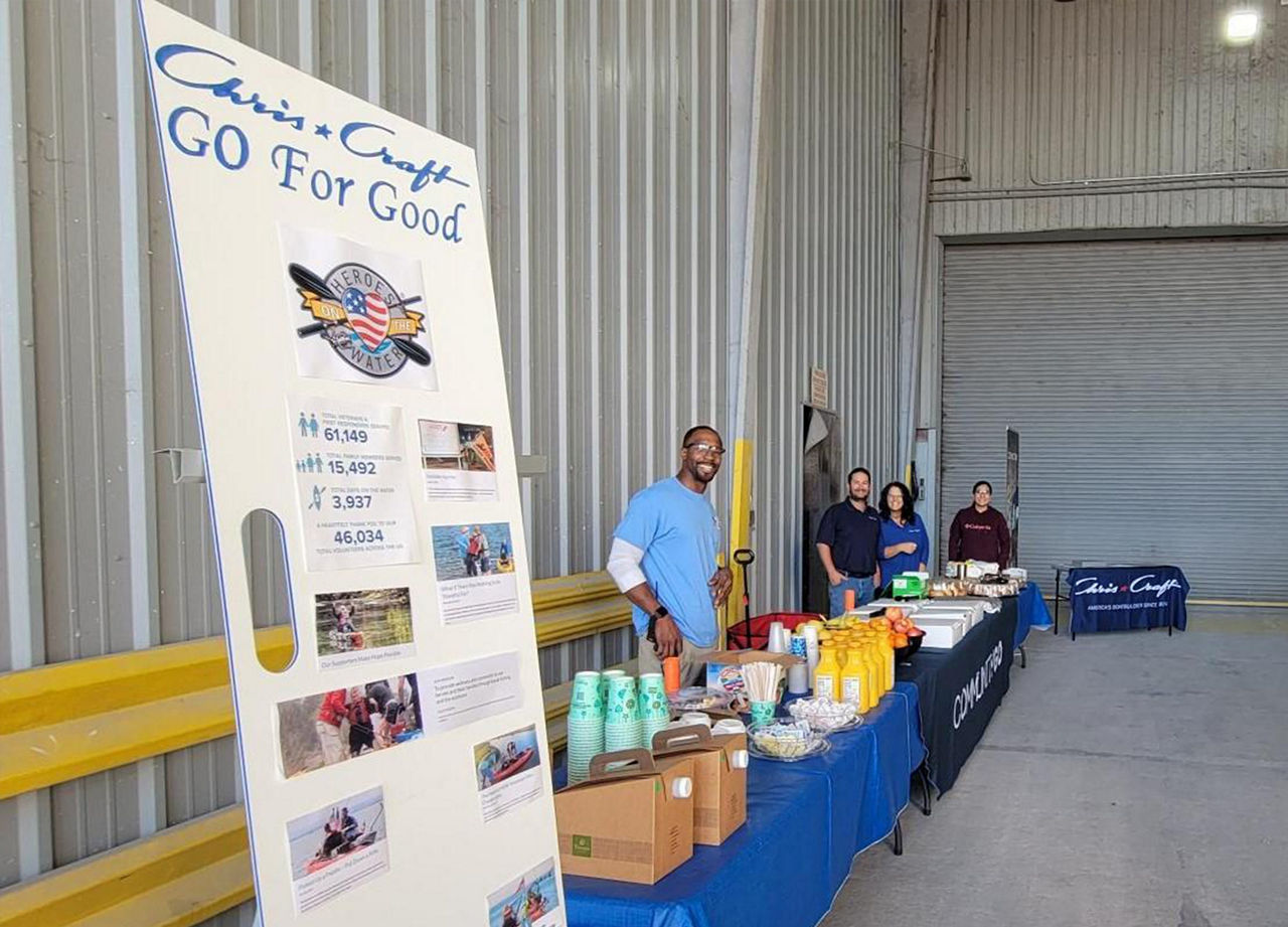 Employees serving breakfast to benefit Heros On The Water