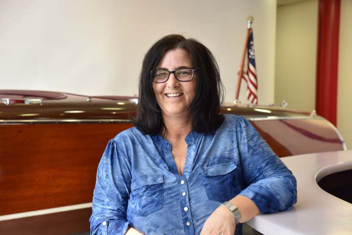 Chris Craft Employee smiling while sitting down