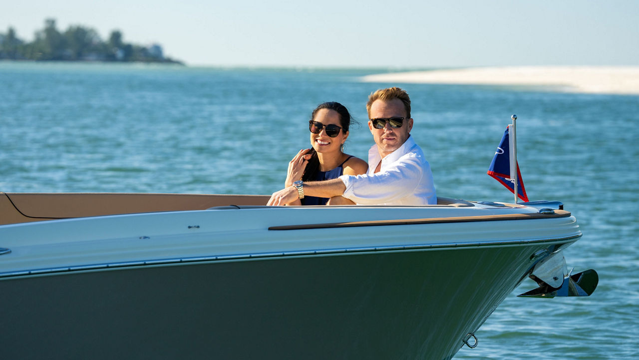 Behind of the chris craft boat on the water