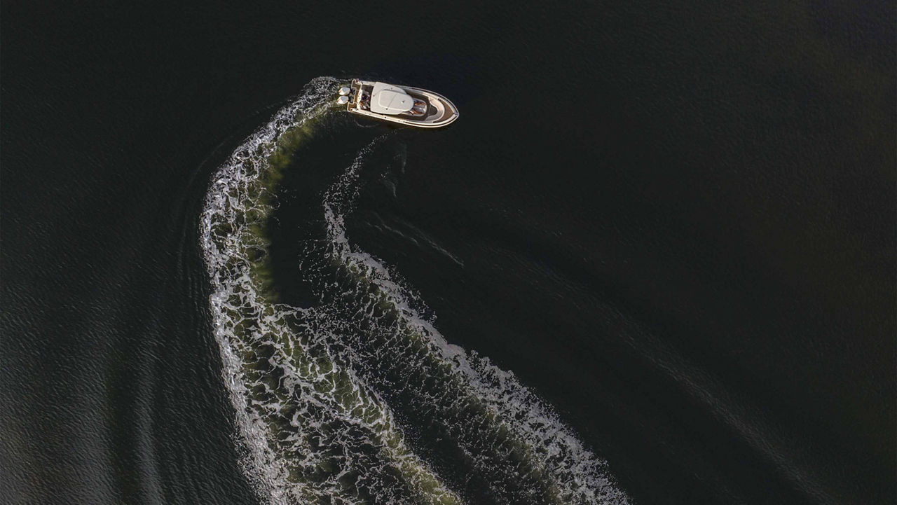 Op top view on chris craft boat on the water