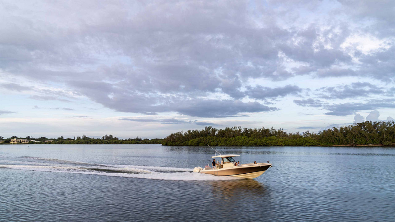 Chris craft boat driving to the right on the water