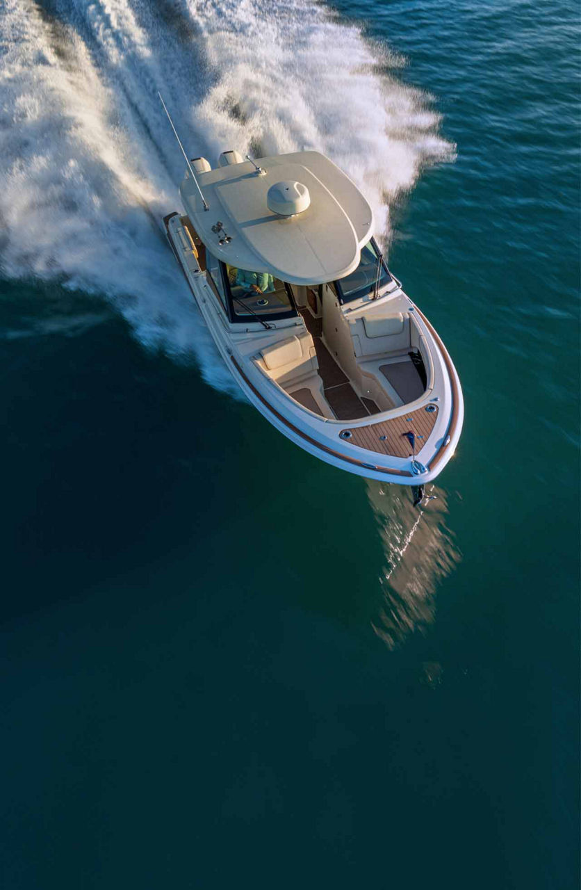 Chris craft boat on the water moving downward