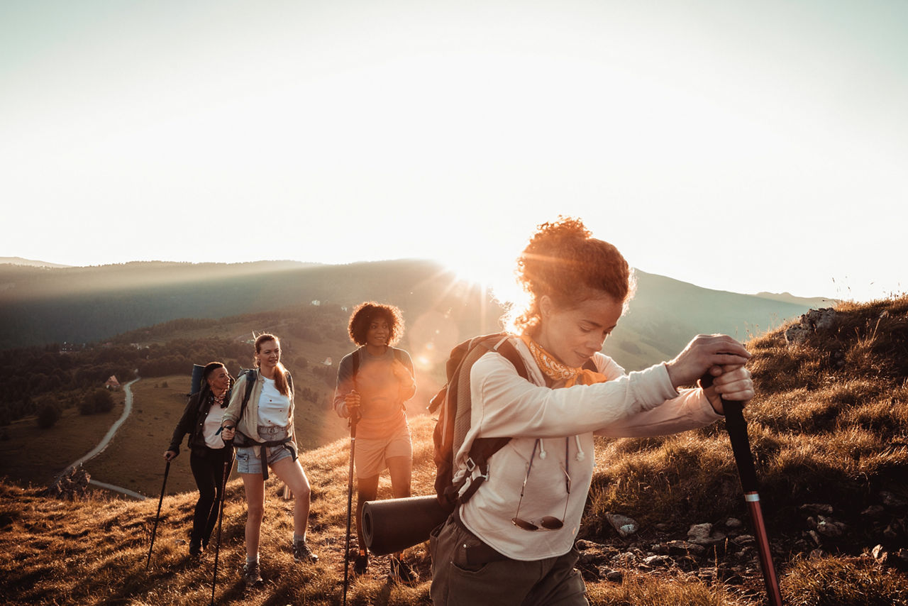 Close up of a group of friends hiking in the mountains