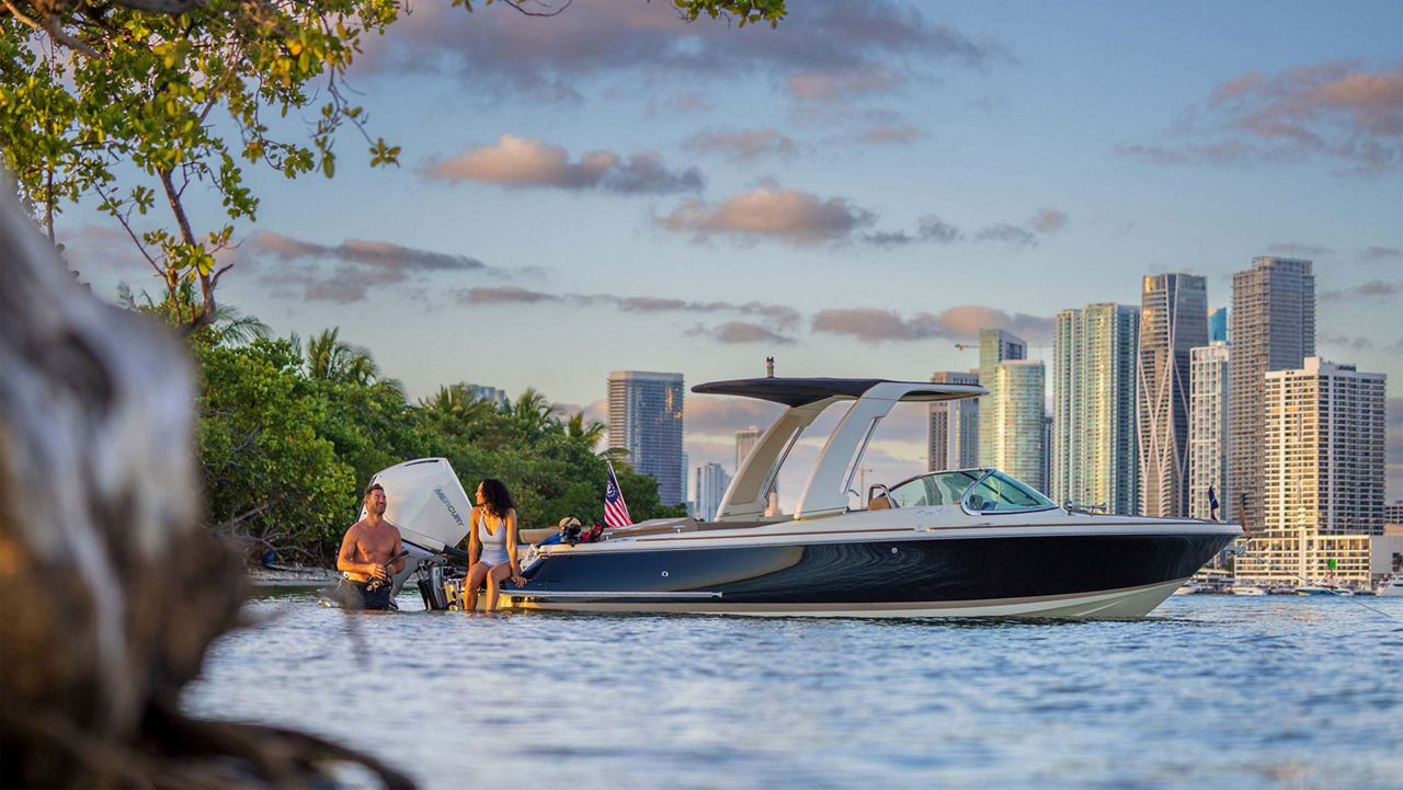 Two people sitting on the Launch 25 GT boat