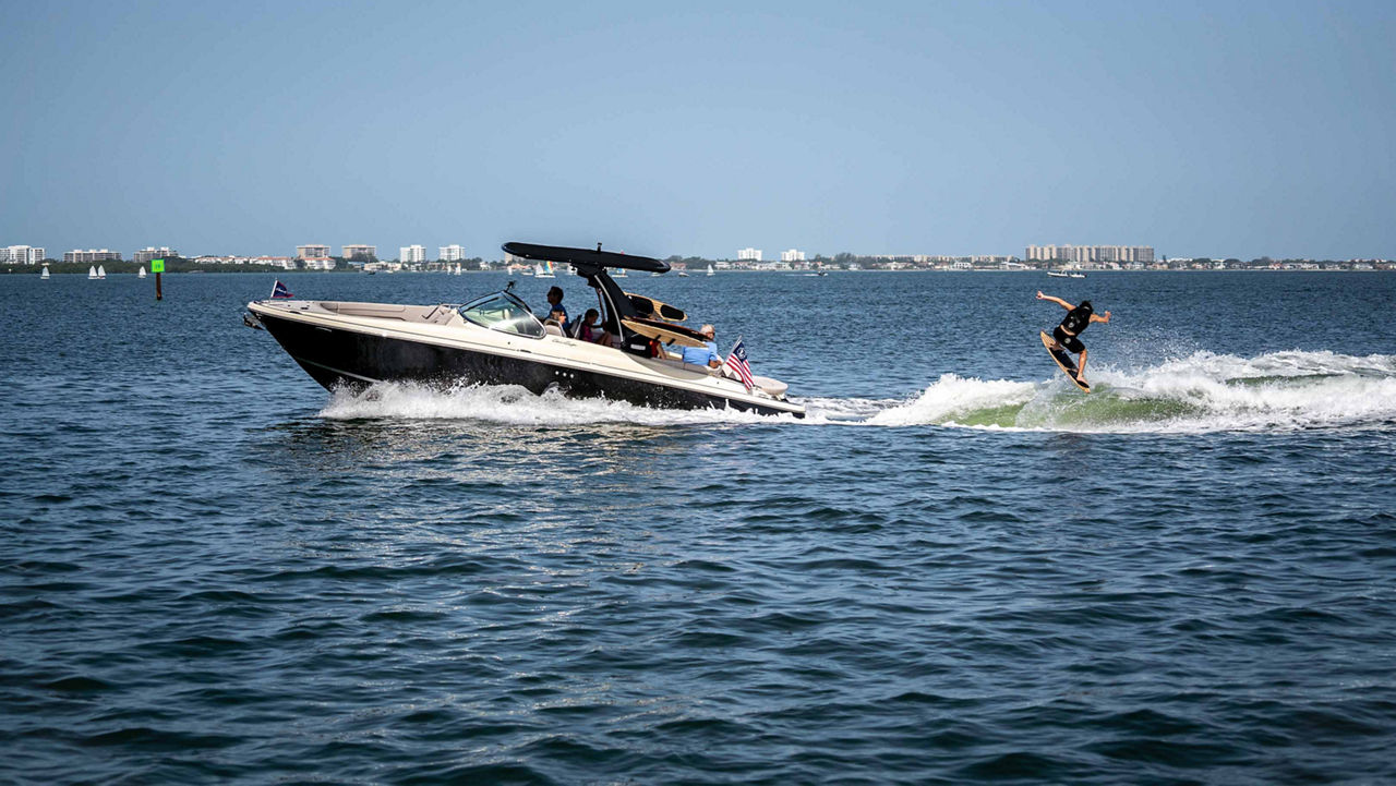 launch 28 gt in water with wakeboarder