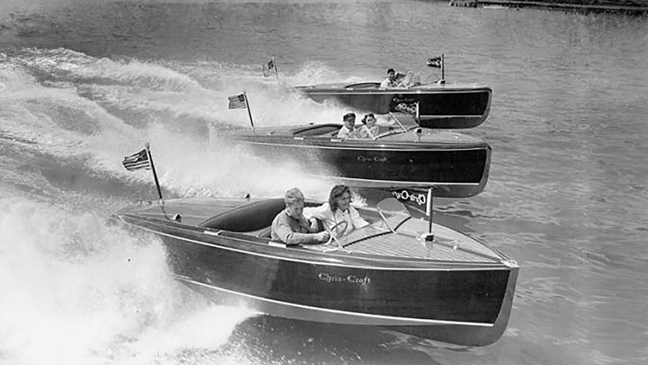 Three chris craft boats on the water