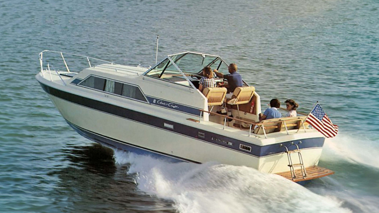 The rear view of a chris craft boat on the water