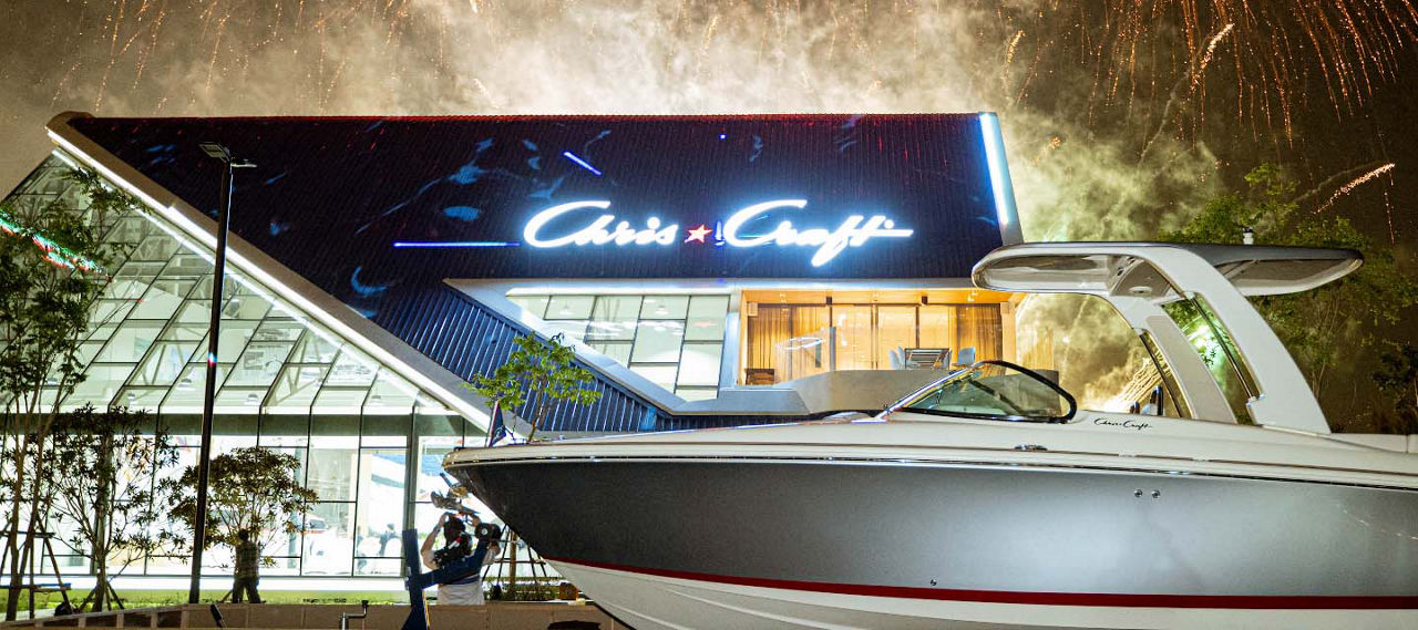 Chris craft logo with a boat in front of it